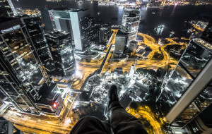 Rooftopping in Hong Kong, sitting on a building at night