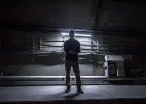 Photo of a guy taken underground while exploring the Hong Kong Metro.