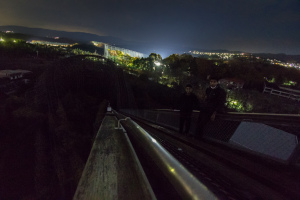 An image from the top of the rollercoaster Aska at night, taken while exploring Nara Dreamland in Japan.
