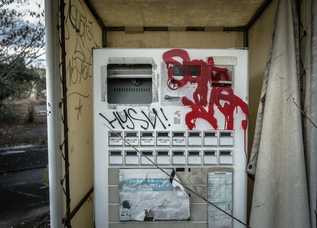 Image of a ticket machine with graffiti at Nara Dreamland