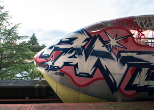 An image of the front section of the train at Nara Dreamland, covered in graffiti