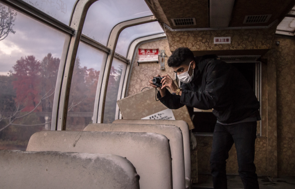 Taking a photo inside the train at Nara Dreamland in Japan