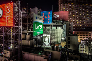 An image of billboards and signs in Tokyo, Japan at night.