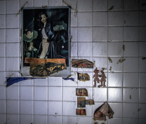 Pictures on a wall in an abandoned slaughterhouse