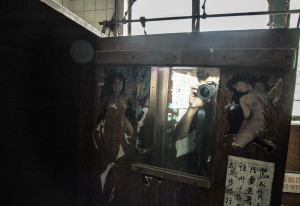 XXX photographs, on a locker in an abandoned area in Hong Kong